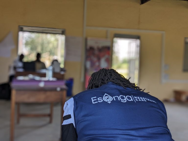Esonga team member wearing a branded vest during community training